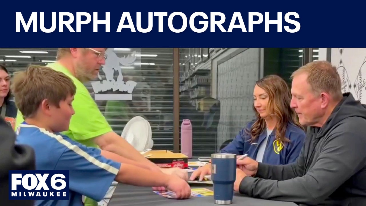 Pat Murphy signs autographs after NLCS win