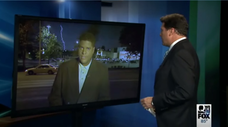 Lightning strikes in reporter live shot
