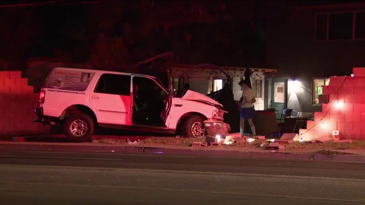 2 in hospital after car crashes into Phoenix home