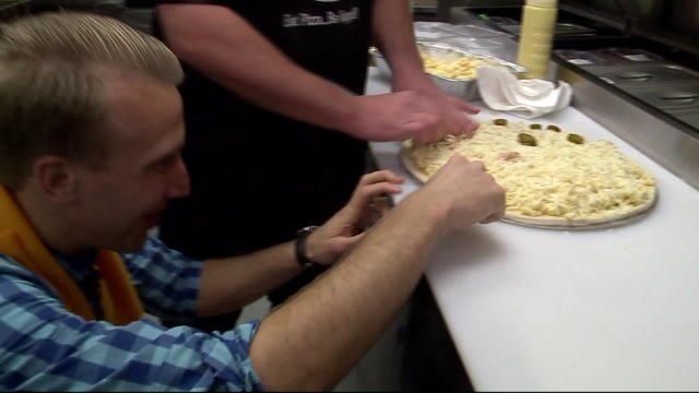 Carl helps prepare food at Upper Crust Pizza