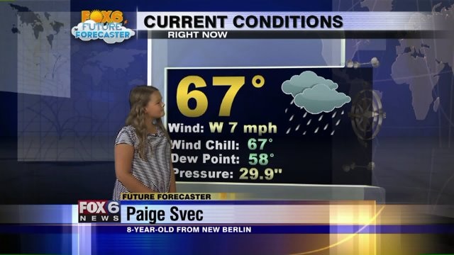 Paige Svec helps Meteorologist Rob Haswell with the weather