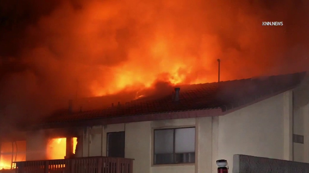 Townhouse catches fire during standoff in Woodland Hills