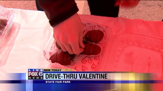 Carl helps package chocolate covered strawberries