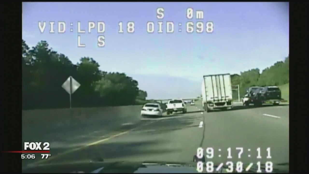 Bank robbery suspects roll after high speed chase on M-14