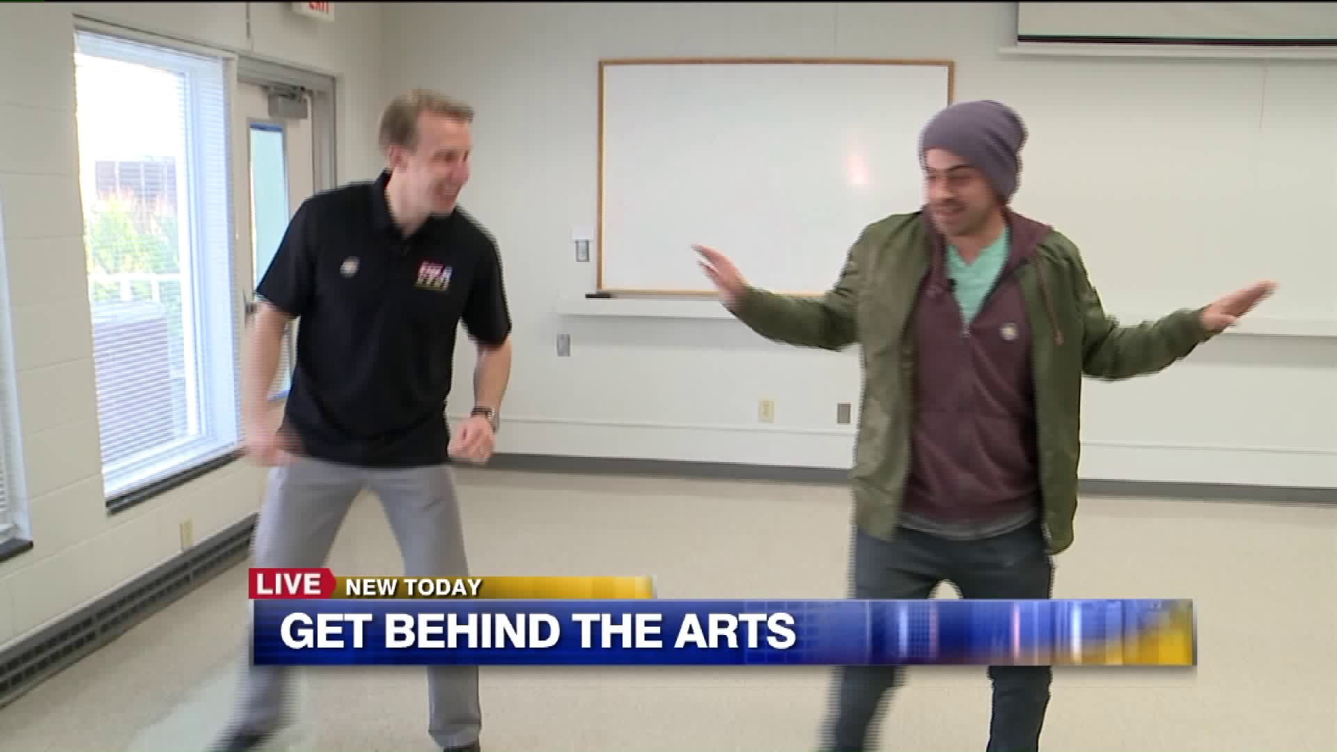 Carl has a blast learning some dance moves