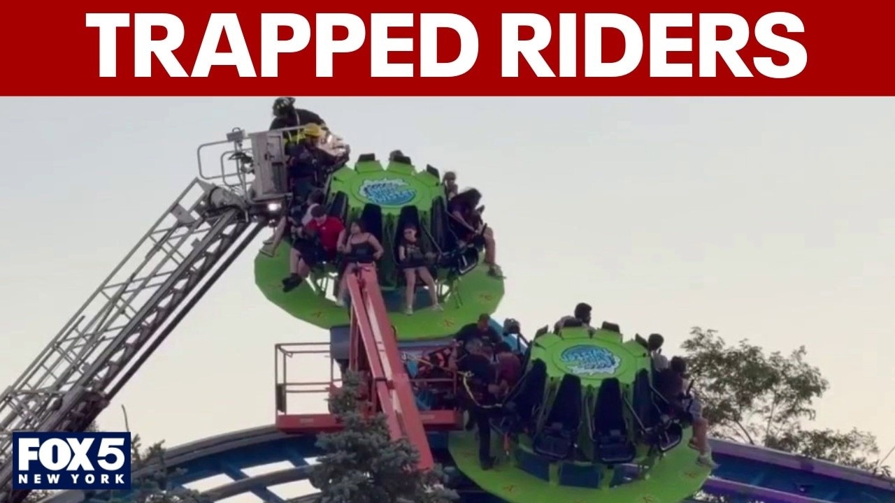Firefighters working to save trapped riders at Adventureland