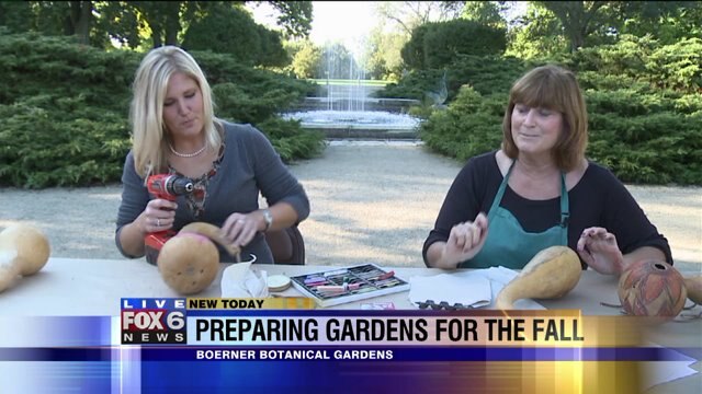 Laura helps make a bird house