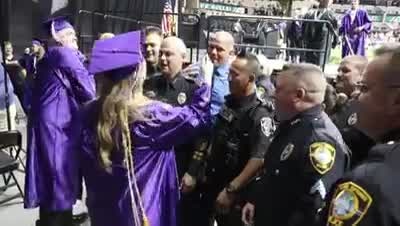 Officers attend graduation for daughter of fallen officer