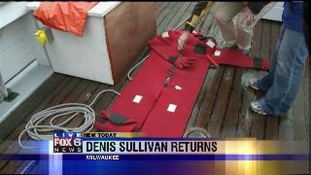 Laura hangs on the Denis Sullivan