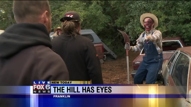 Laura gets in character, attempts to scare visitors
