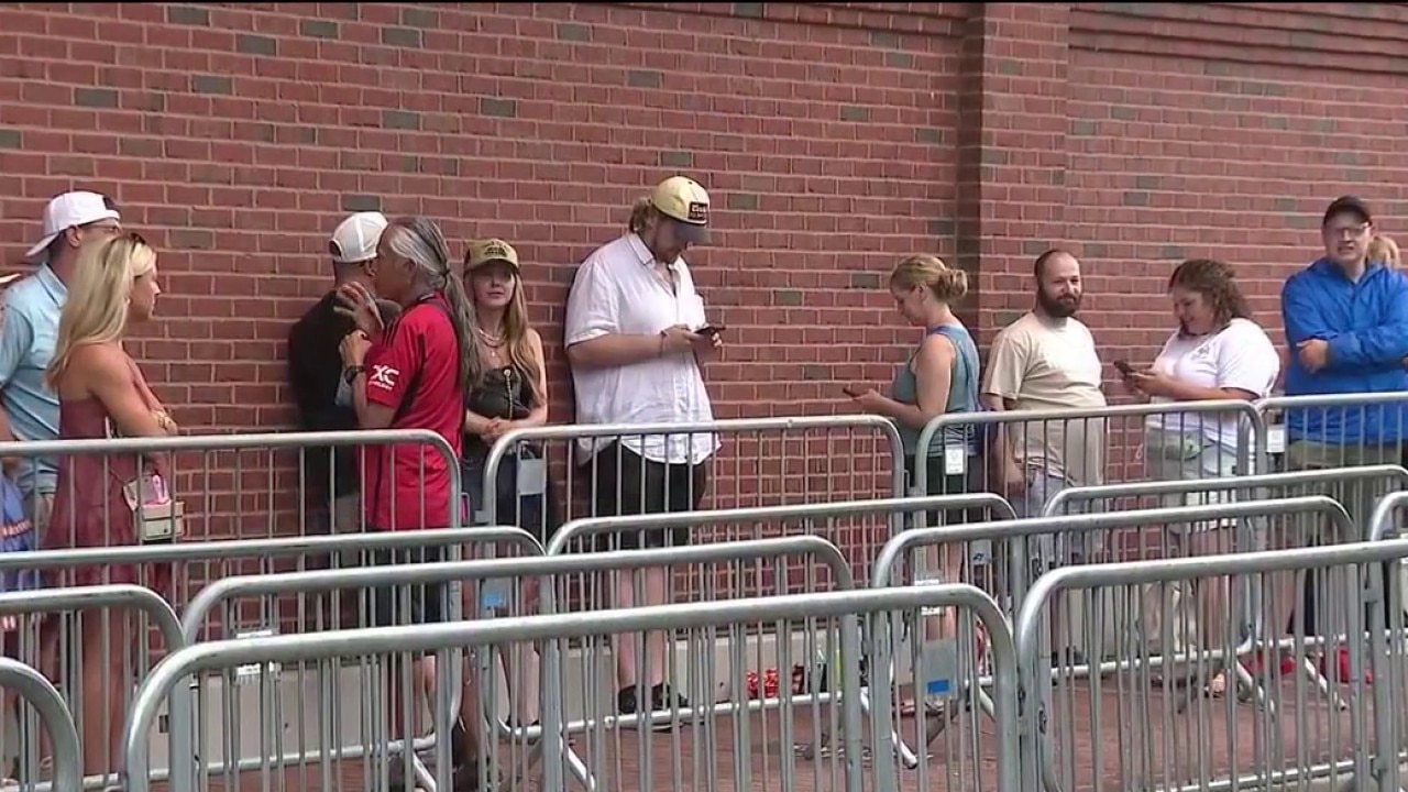 'We're just praying and hoping': Mumford & Sons fans wait outside Wrigley Field amidst weather watch
