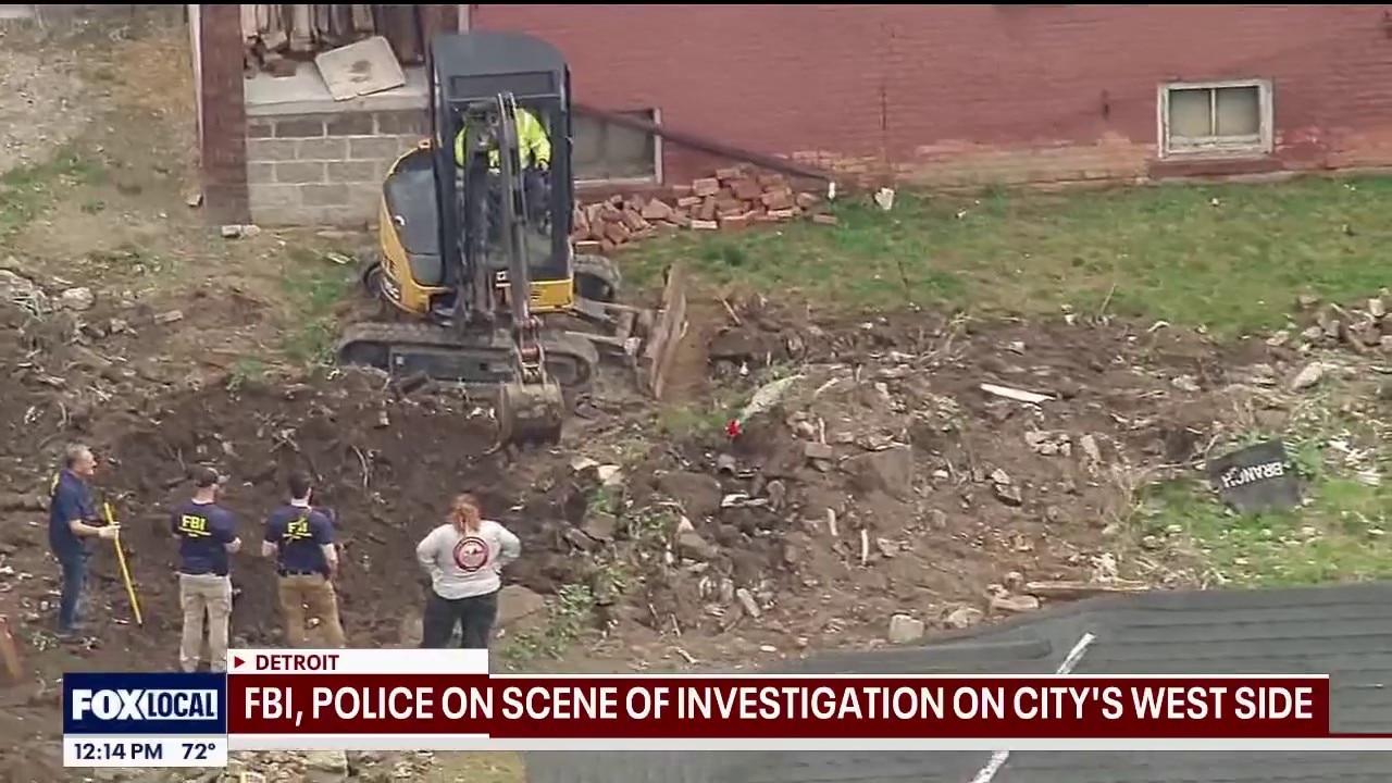 Police at scene conducting dig in Detroit yard Monday