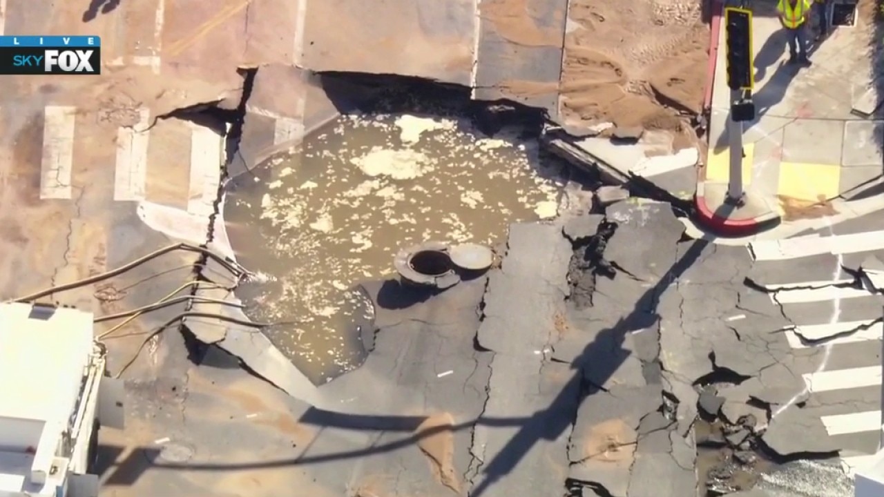 Large sinkhole forms in West Hollywood amid flooding