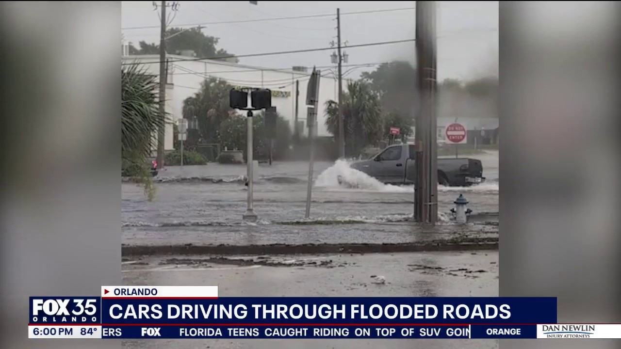 Watch: Cars drive through flooded roads in Orlando