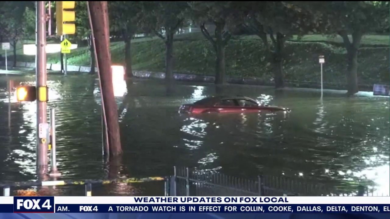 Car seen stuck in floodwater in southwest Fort Worth