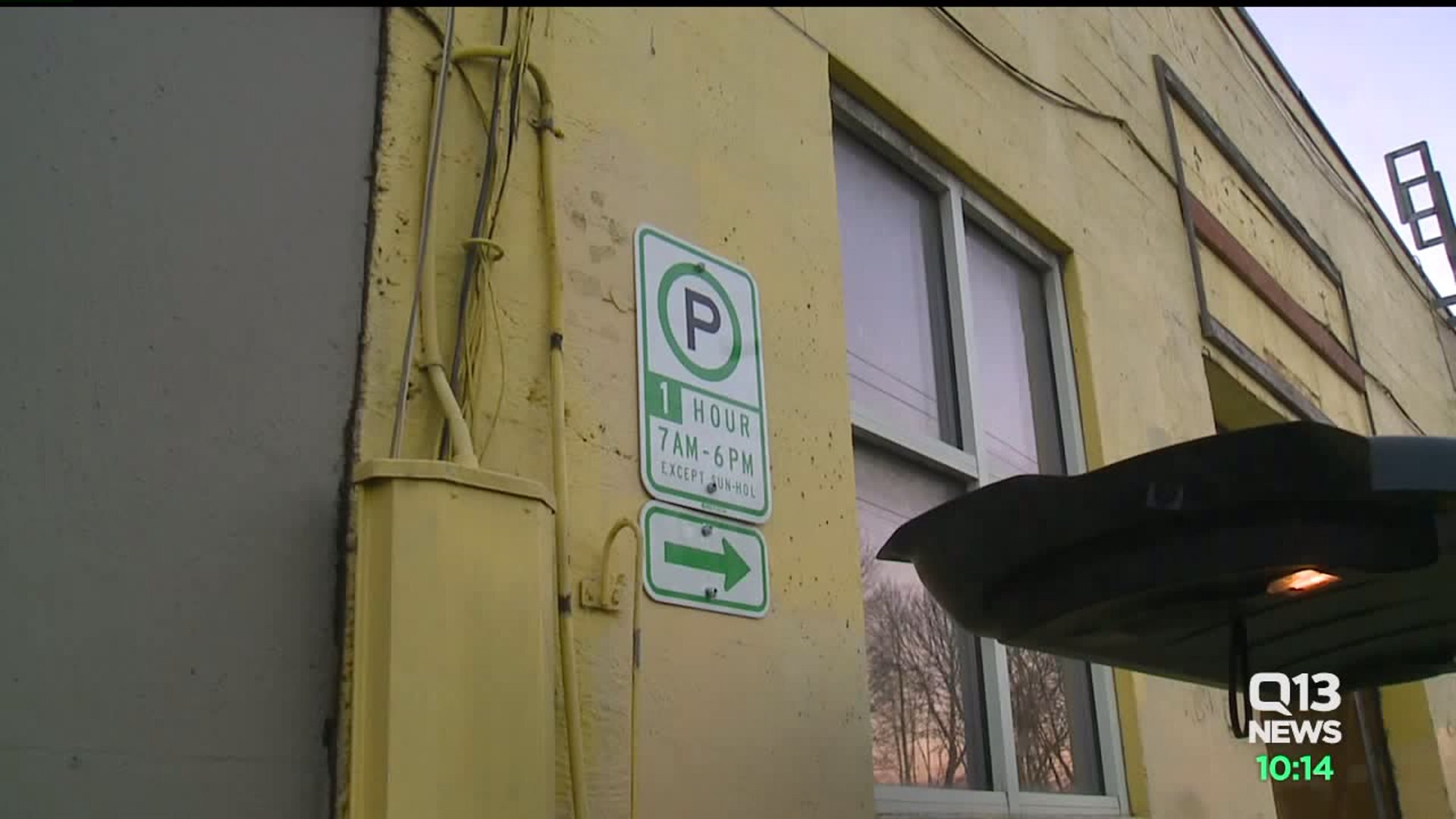 Business owner in battle with city over Sodo parking spots, gets fined $500 a day