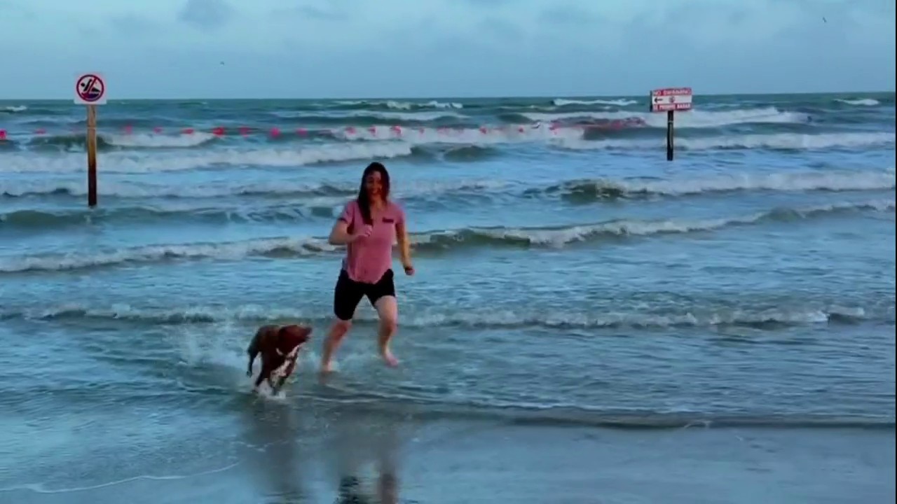 Christina Koch on the beach with Sadie
