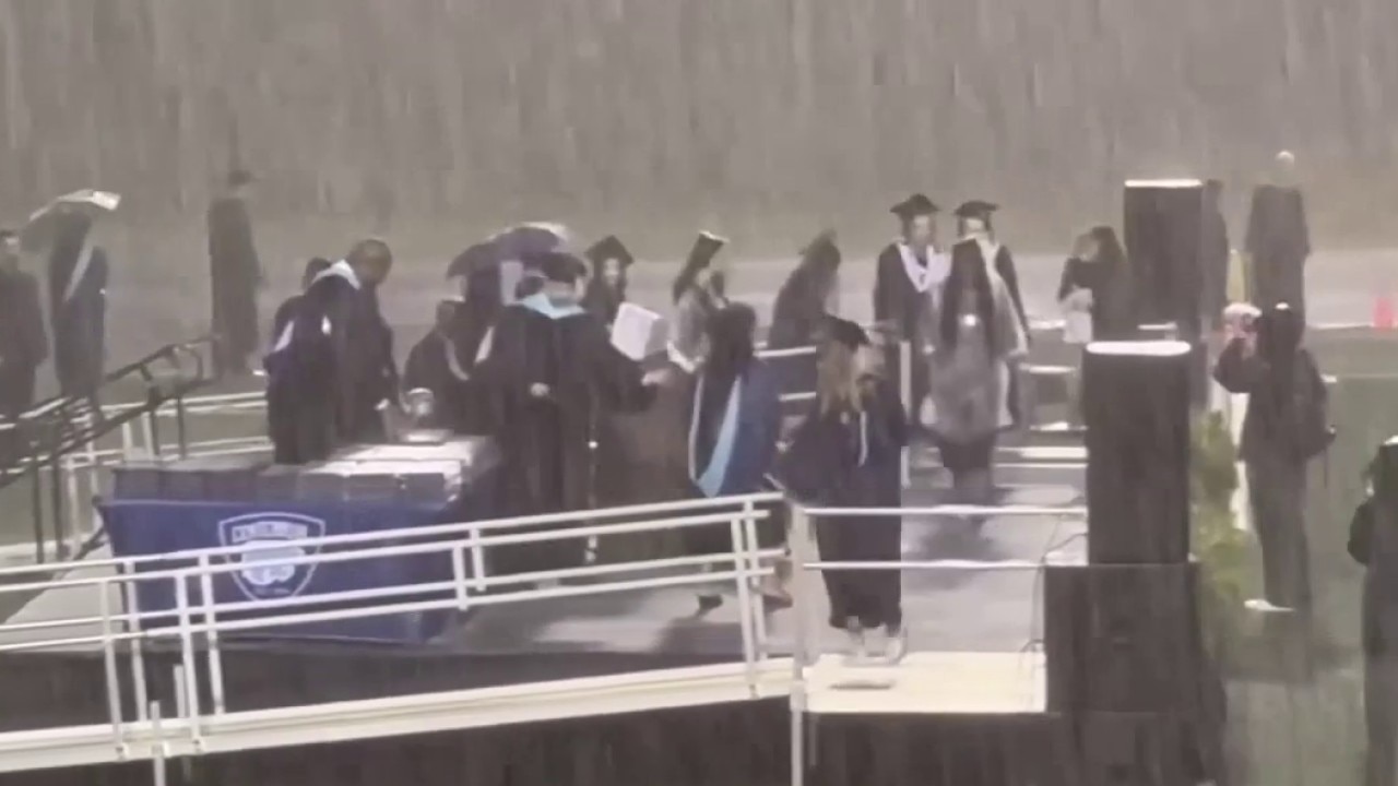 Families furious over graduation in torrential rain