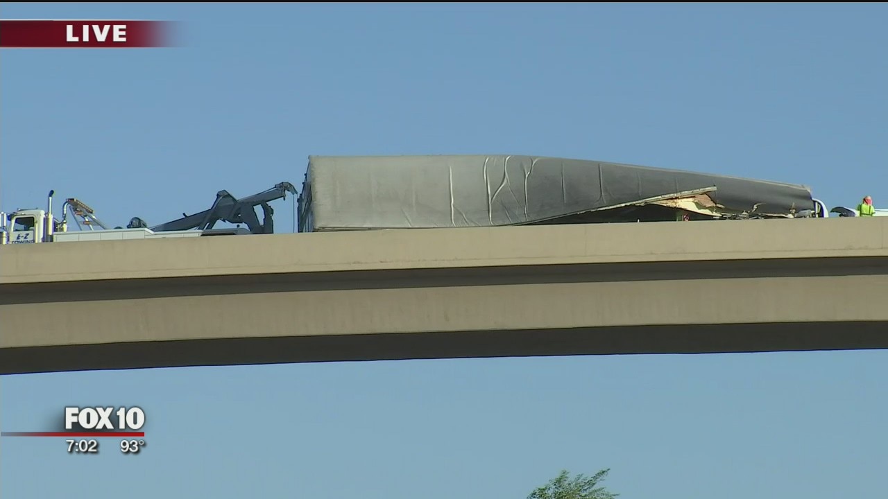 Semi-truck carrying produce flips on its side along I-10 ramp