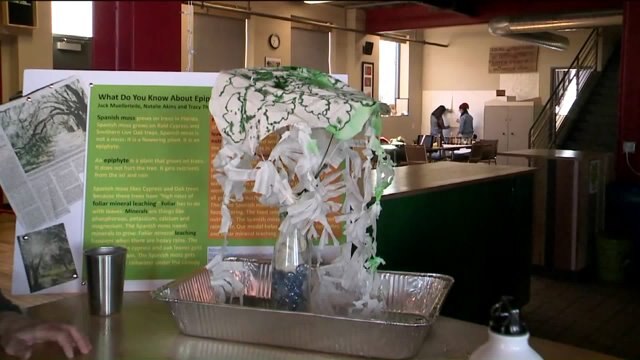 Kramp checks out science fair projects at Escuela Verde