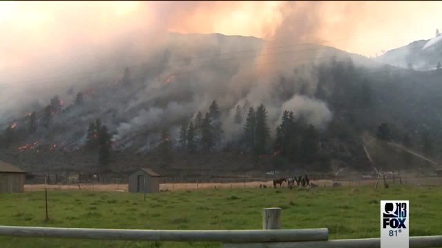 Wildfire still threatening homes
