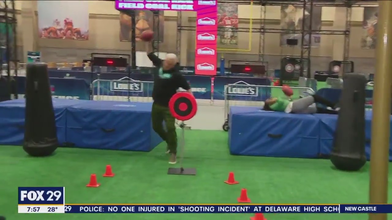 FOX 29's Alex Holley and Mike Jerrick compete at the official Super Bowl training camp