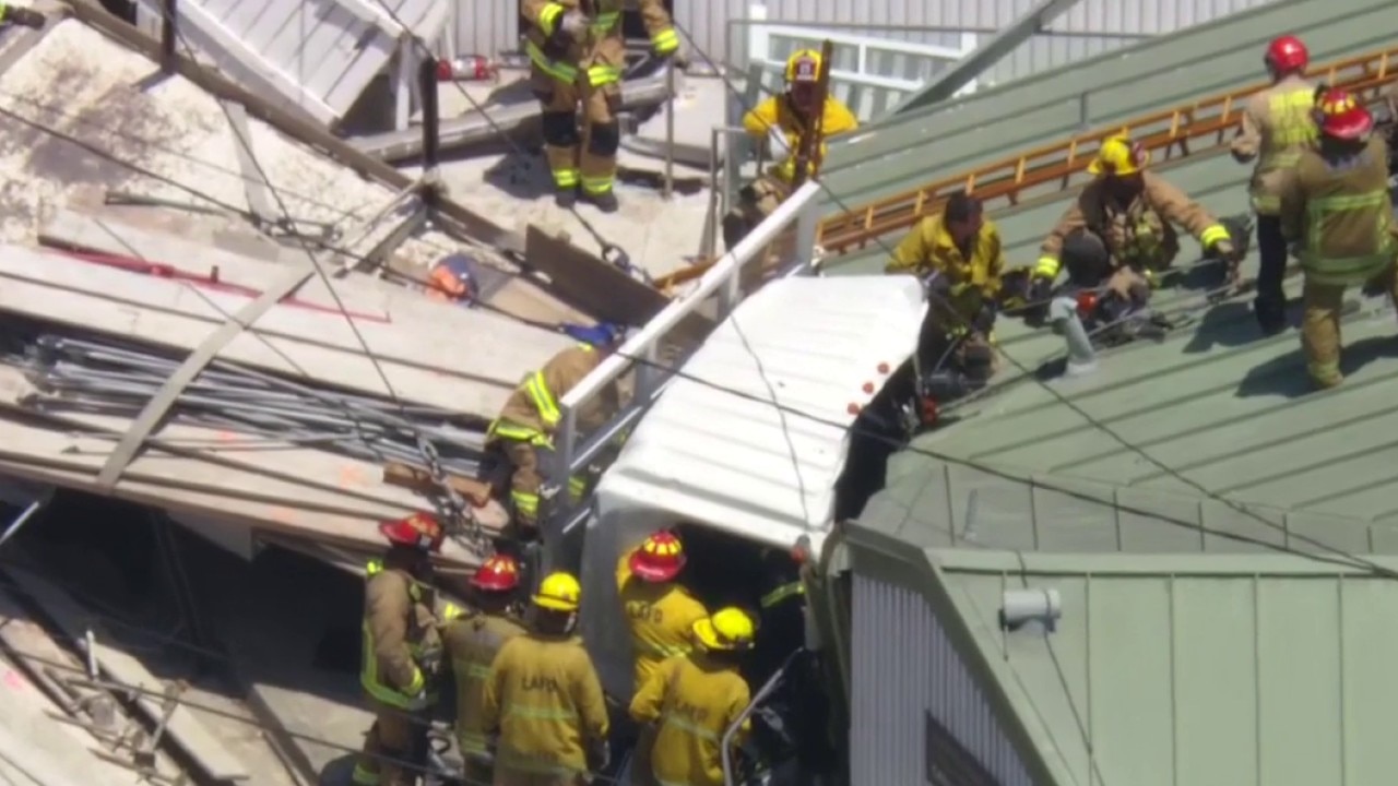 Firefighters work to save trapped driver along PCH