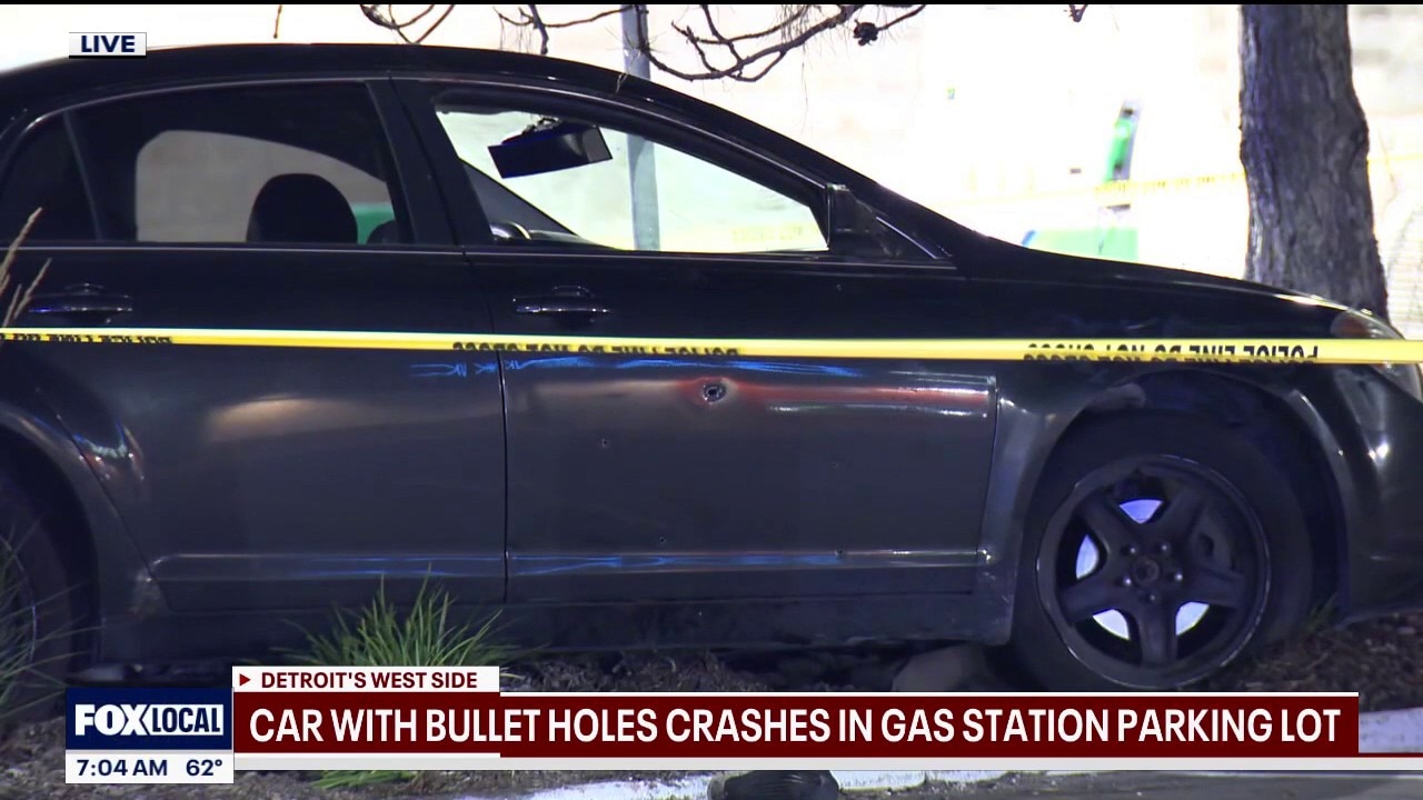 Detroit police investigate bullet-riddled car that crashed at gas station