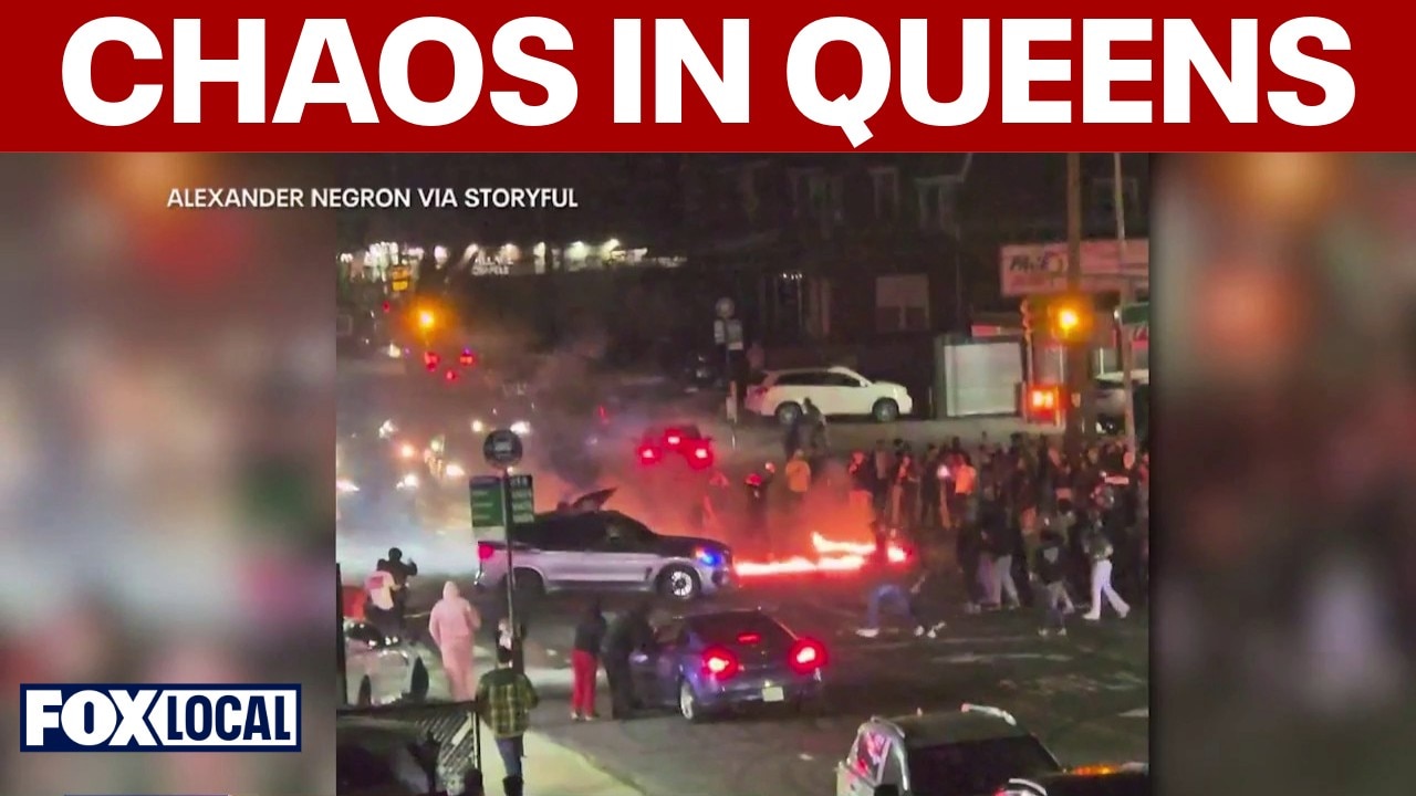 Wild street takeover in Queens: Suspects jump on squad car