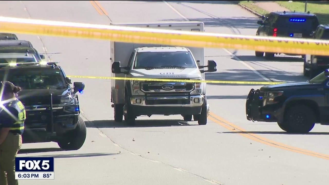 Officer shoots gunman holding mother, child hostage