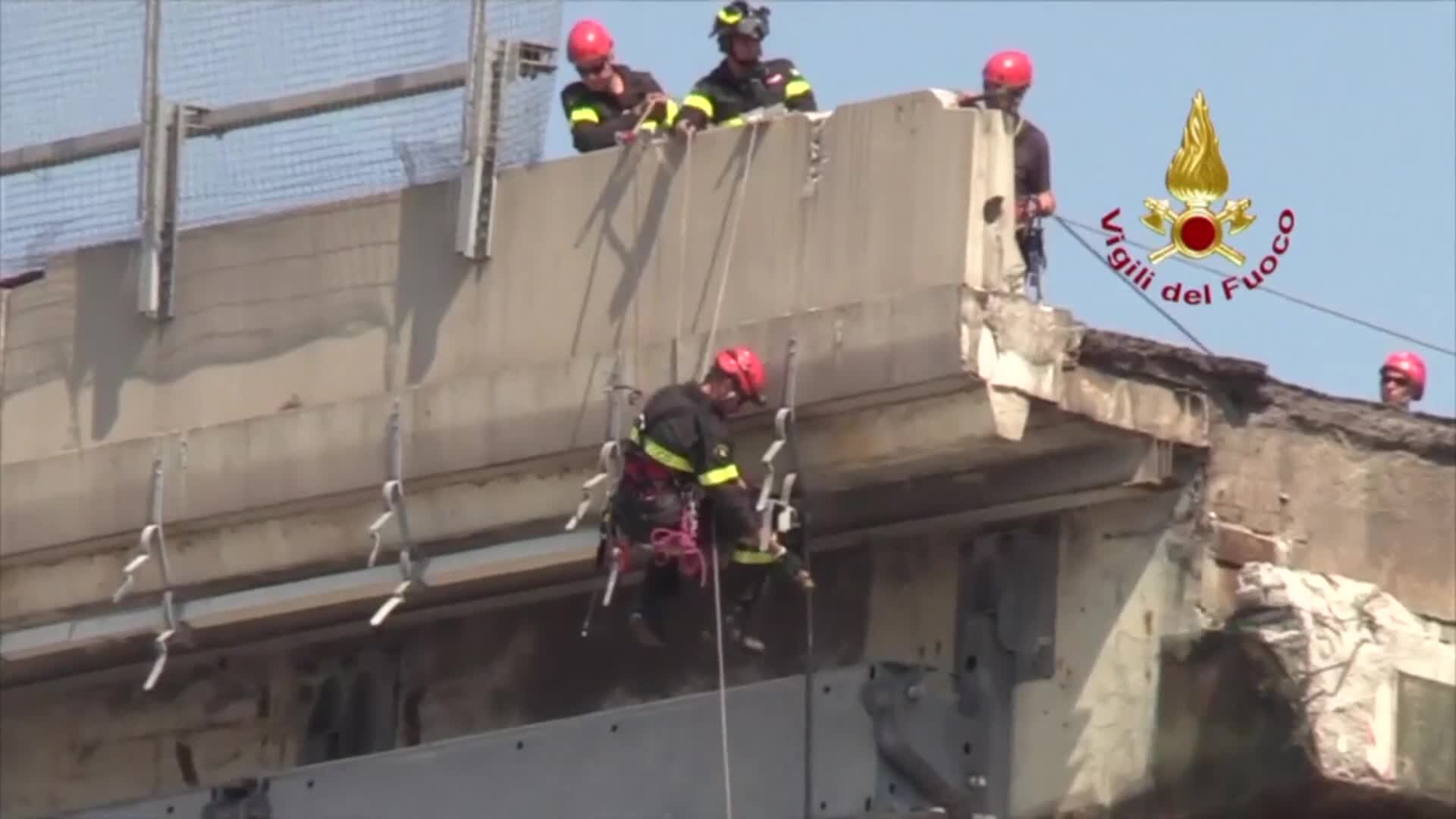 ITALY_BRIDGE_COLLAPSE___FIREFIGHTERS_SECURE_BRIDGE__AERIALS___MGZMDMD.mp4