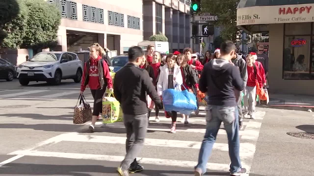High school students hand out 250 bags of essentials to homeless