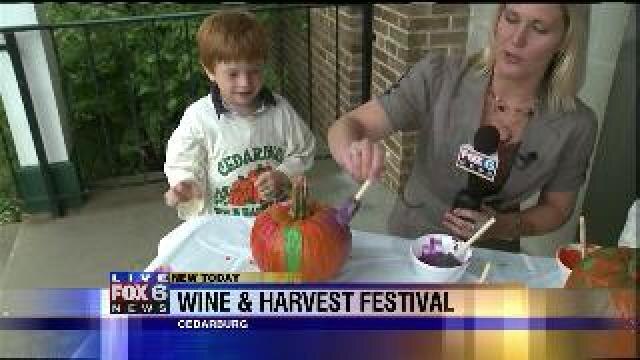 Laura paints pumpkins at Wine & Harvest Festival