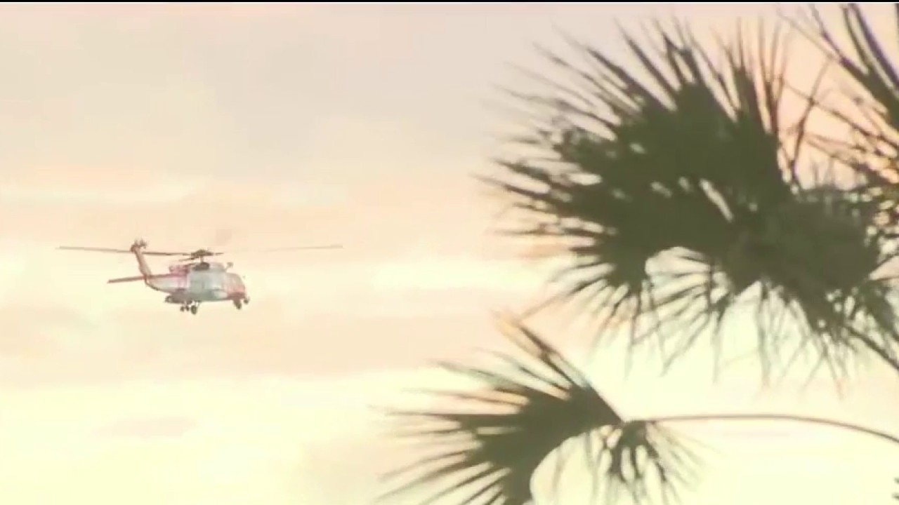 Coast Guard surveys storm damage on beach