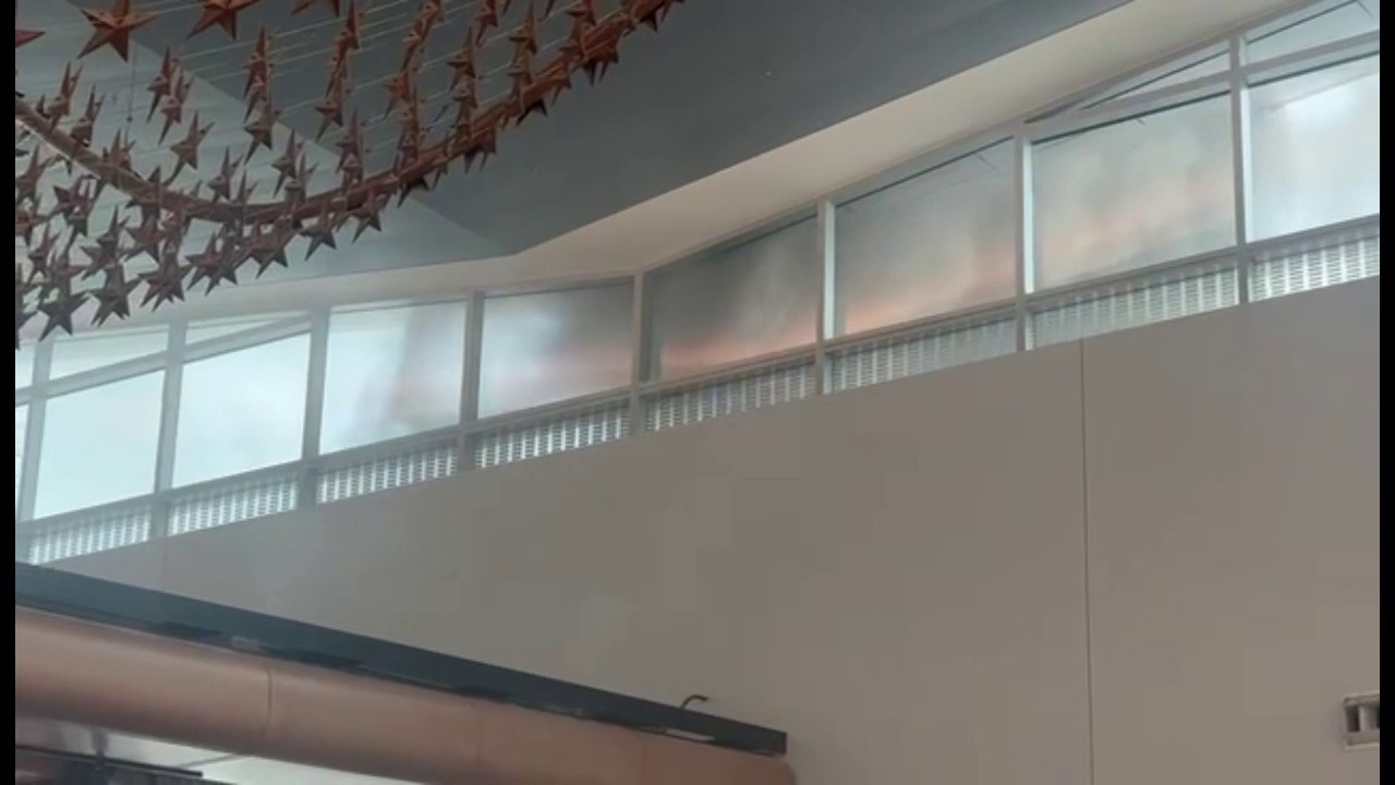 Smoke rises over Houston's Bush Airport after restaurant fire