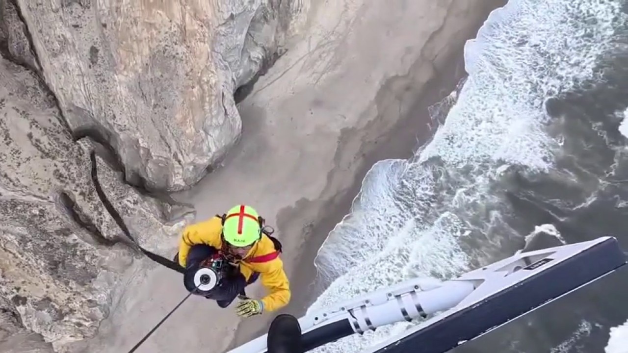 Paraglider rescued after crashing into cliff