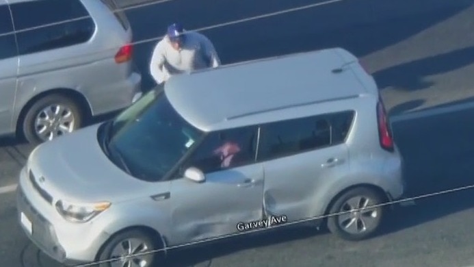 Man runs up to pursuit suspect's car