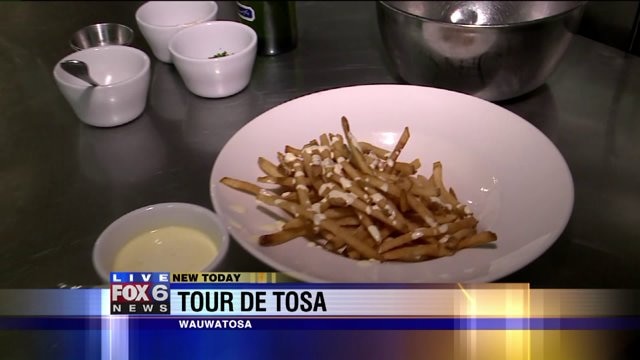 Julie talks with a check as she previews Tour de Tosa