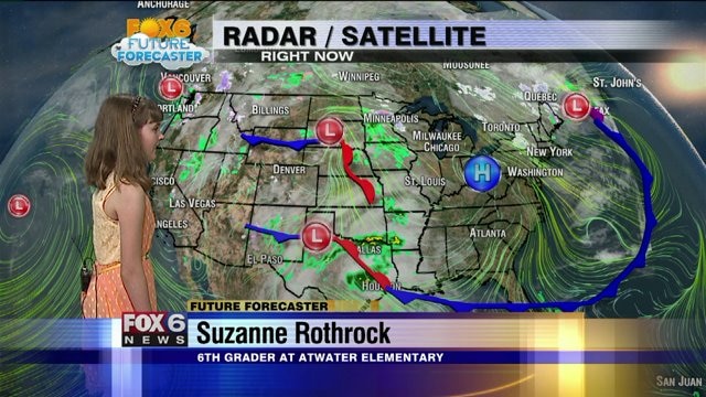 Suzanne helps Meteorologist Rob Haswell with the weather