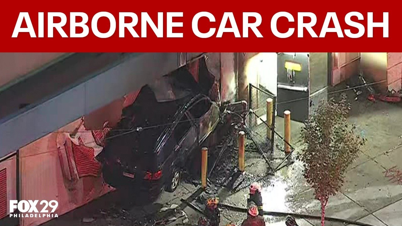 Driver dead after car goes airborne, slams into side of building in Kensington