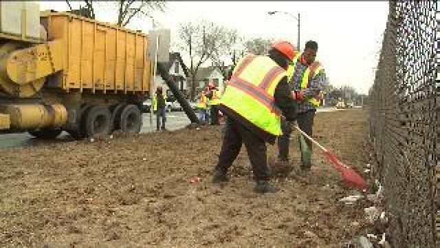 Crews work to clean up litter and debris