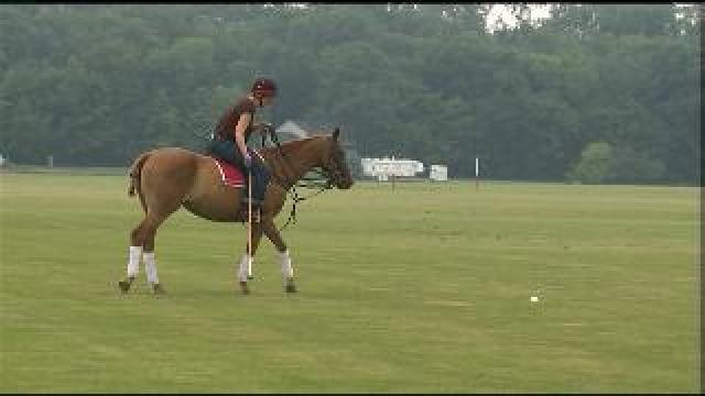 Laura plays polo