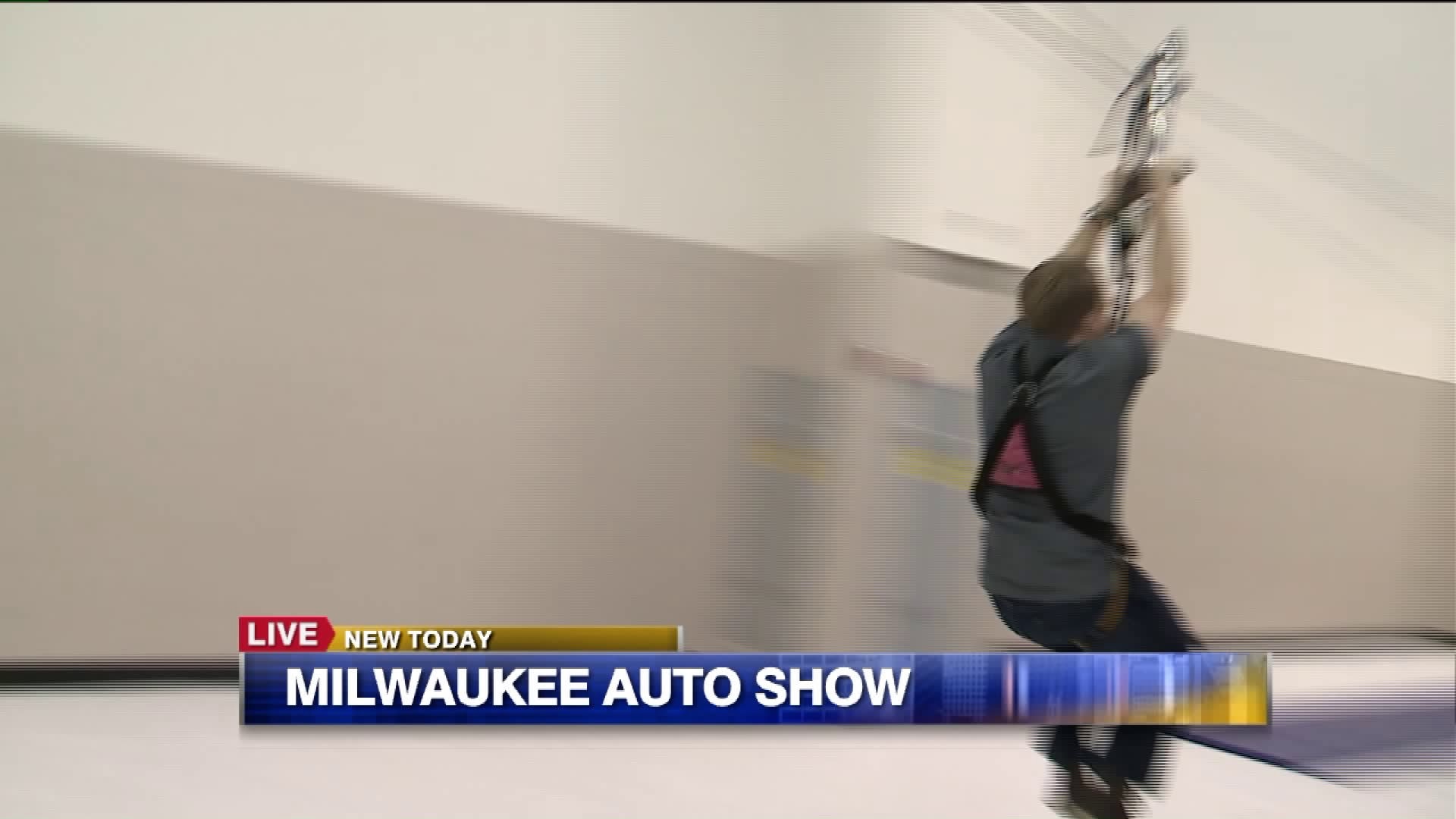 Carl checks out the zip line at the Wiscosnin Center as he previews the Milwaukee Auto Show