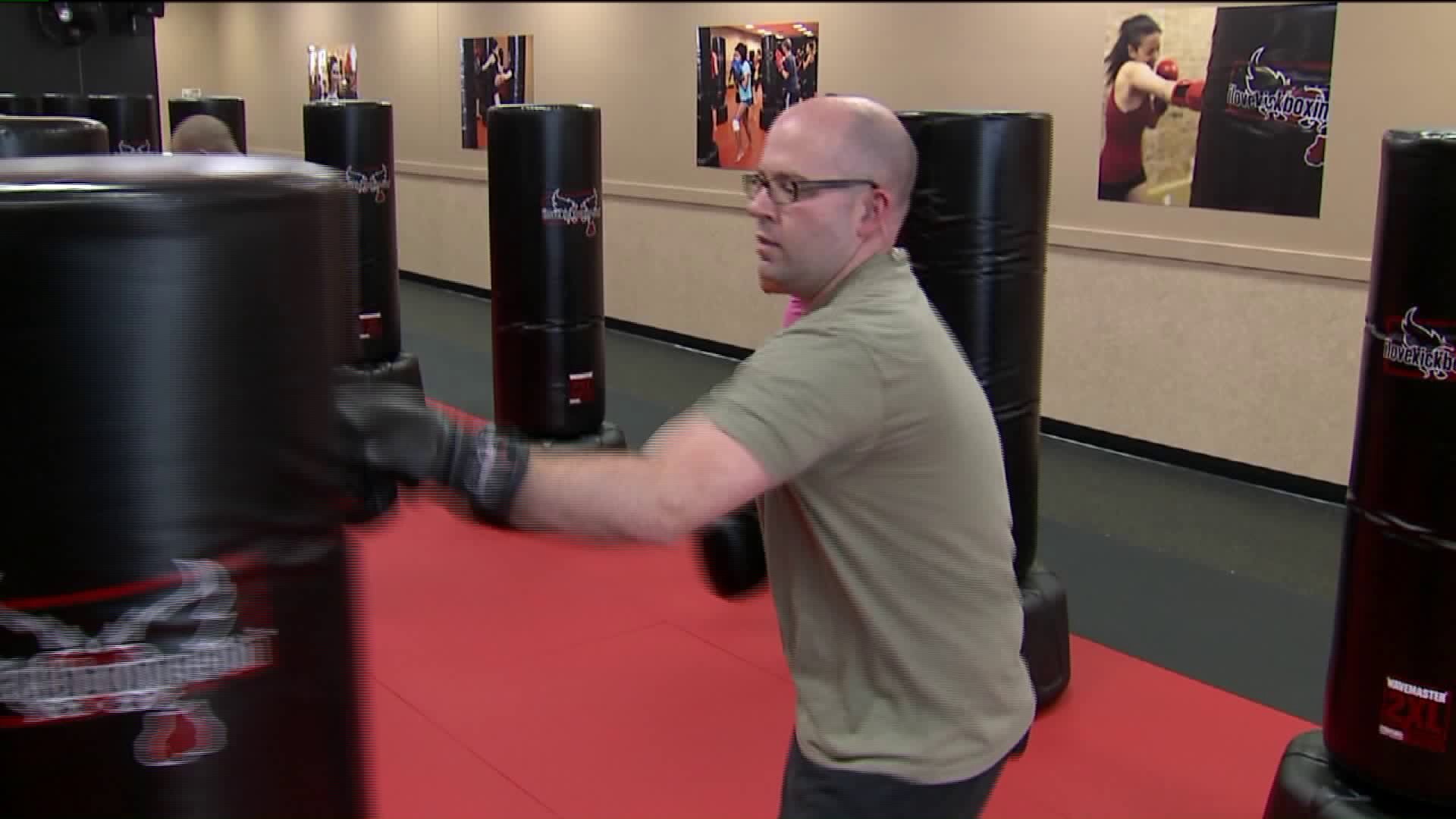 Kramp learns some moves as he works out at I Love Kickboxing
