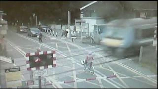 Bicyclist nearly struck by train in UK