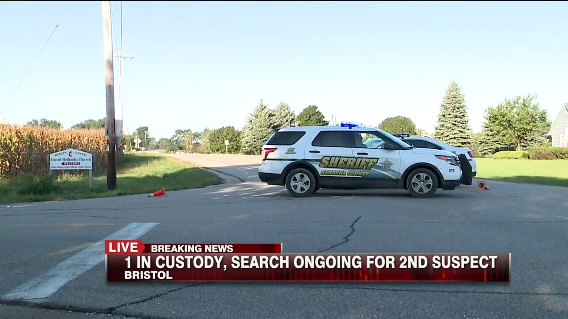 1 arrested, 1 sought after armed robbery, pursuit