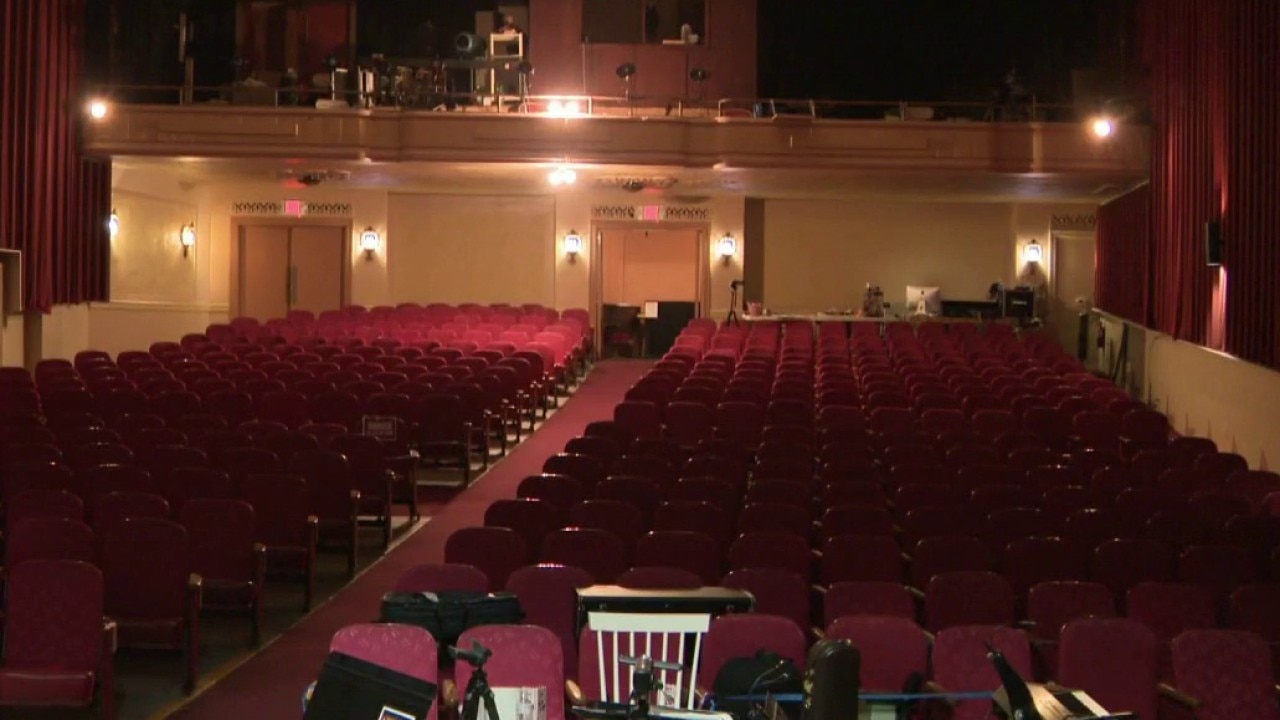 Rain and burst pipe flood Kenosha theater