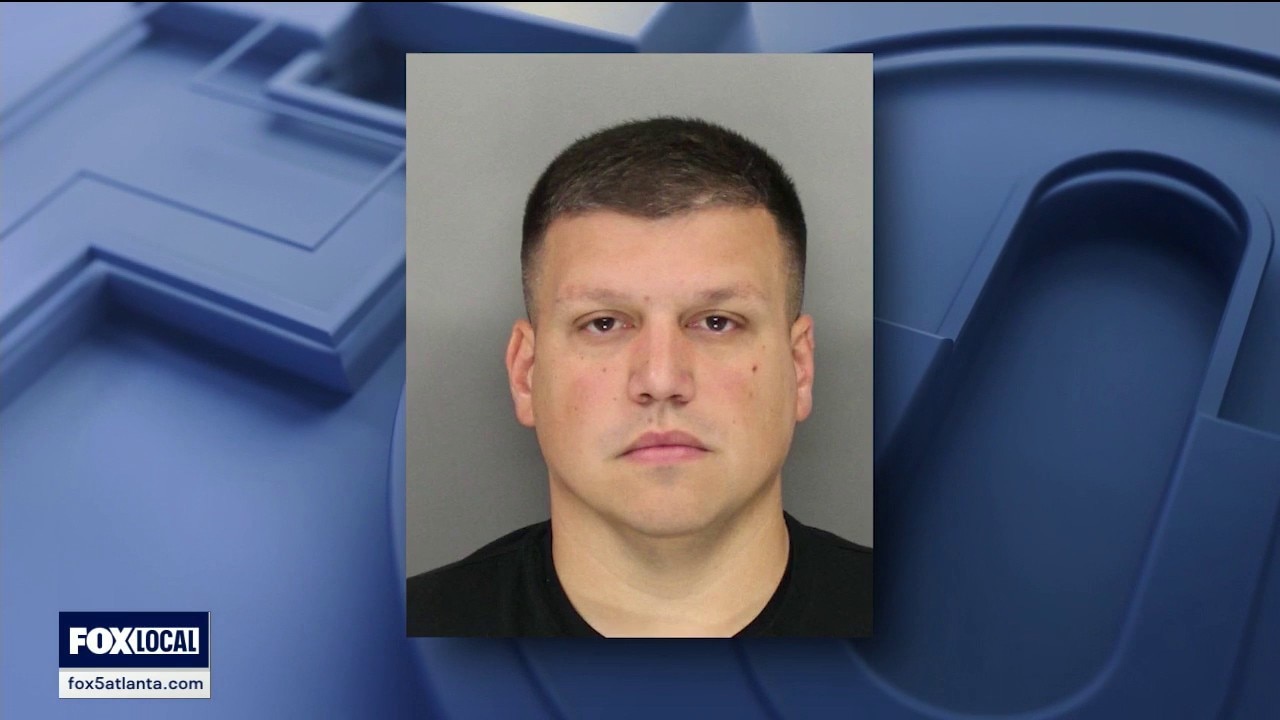 Former Acworth officer turns himself in at Cobb County Jail