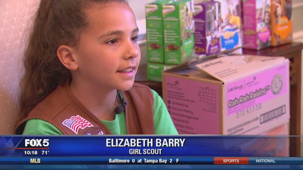 Girl Scout delivers donated cookies to police