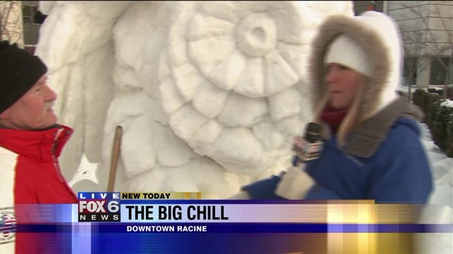 Laura gets details on the snow carving competition
